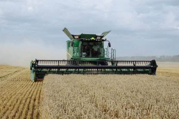 A John Deere combine harvesting grains in Ukraine