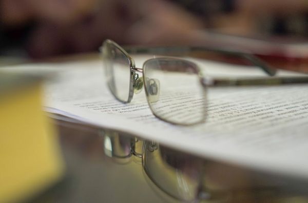 Glasses on top of documents