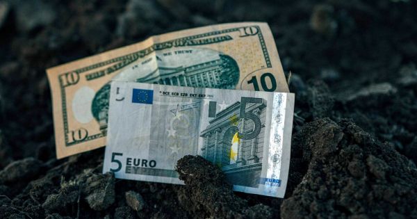 Dollar and Euro bills in a field in Ukraine