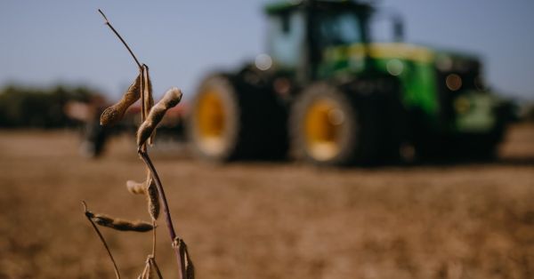 A John Deere tractor is working in a soybean field in Ukraine