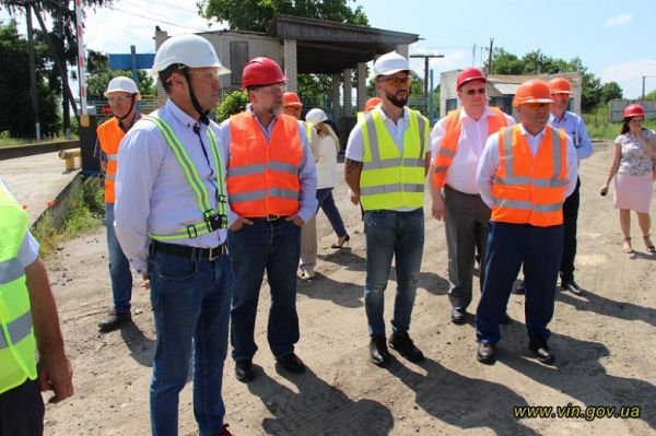 Companies' officials at the mill construction site