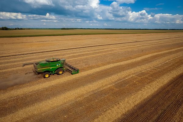 A John Deere combine harvesting barley in Ukraine