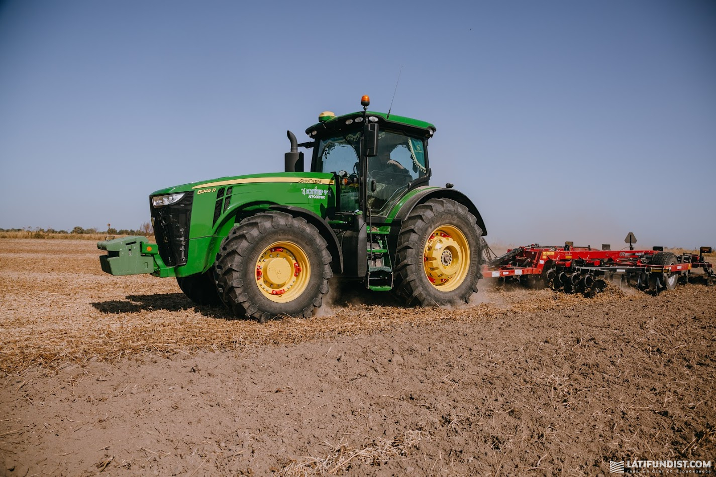 A.G.R. Group machinery: disc harrows towed behind a John Deere 8345R tractor