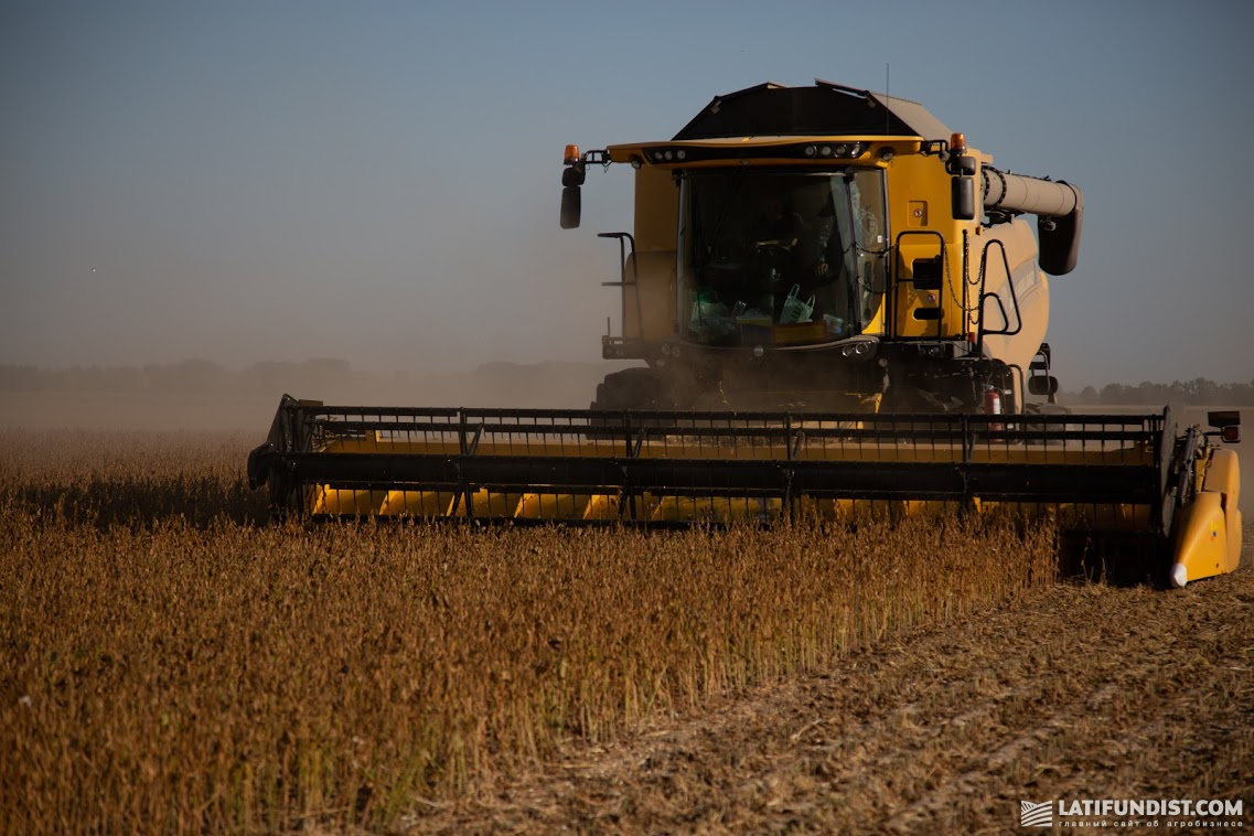 New Holland harvester cutting soybean in A.G.R. Group field