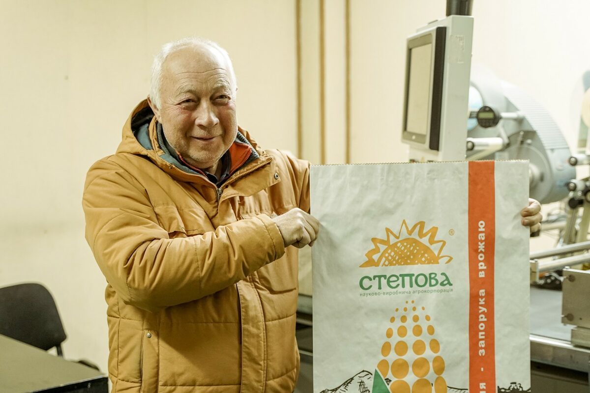 Oleksandr Lemayev, director of the Stepova seed treatment plant, demonstrates a pack of for branded seeds